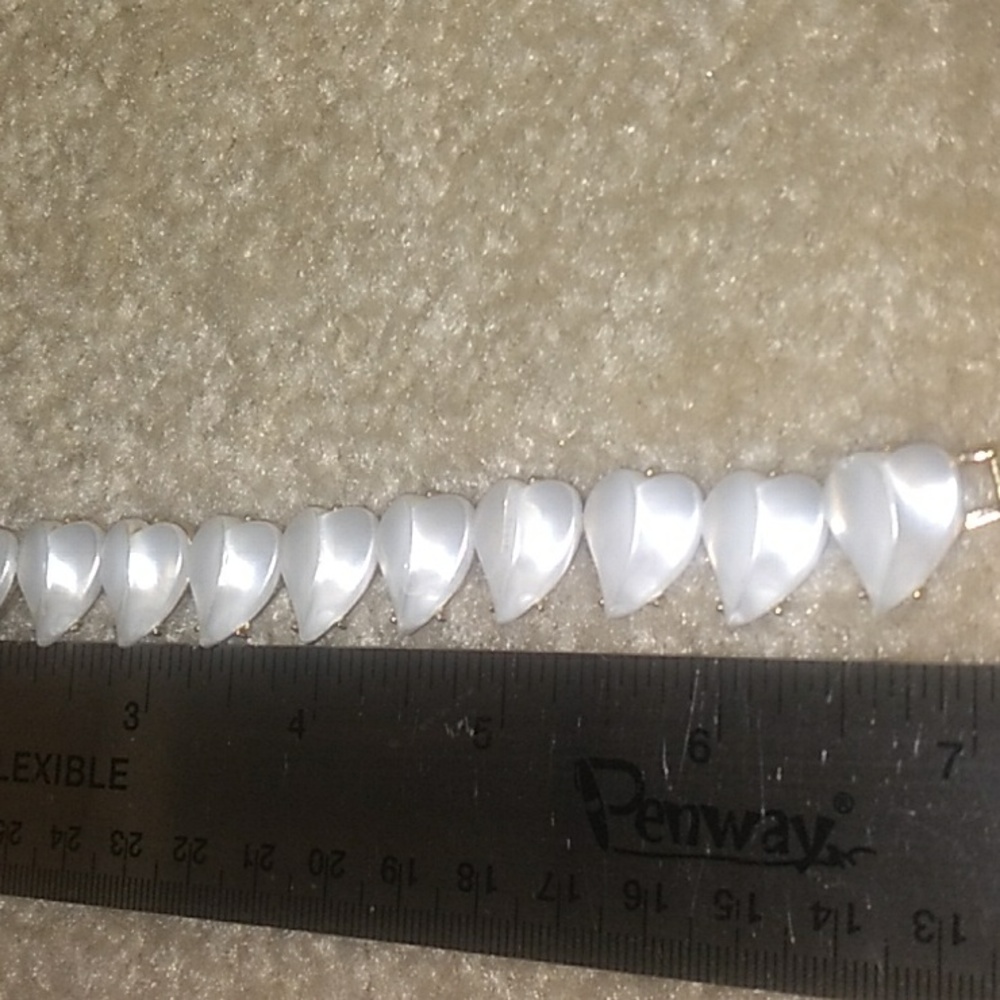 A VINTAGE TRIFARI FAUX MOTHER OF PEARL BRACELET. 7" SB.19